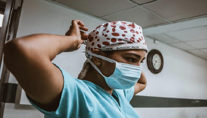 medical resident prepping to help in surgery